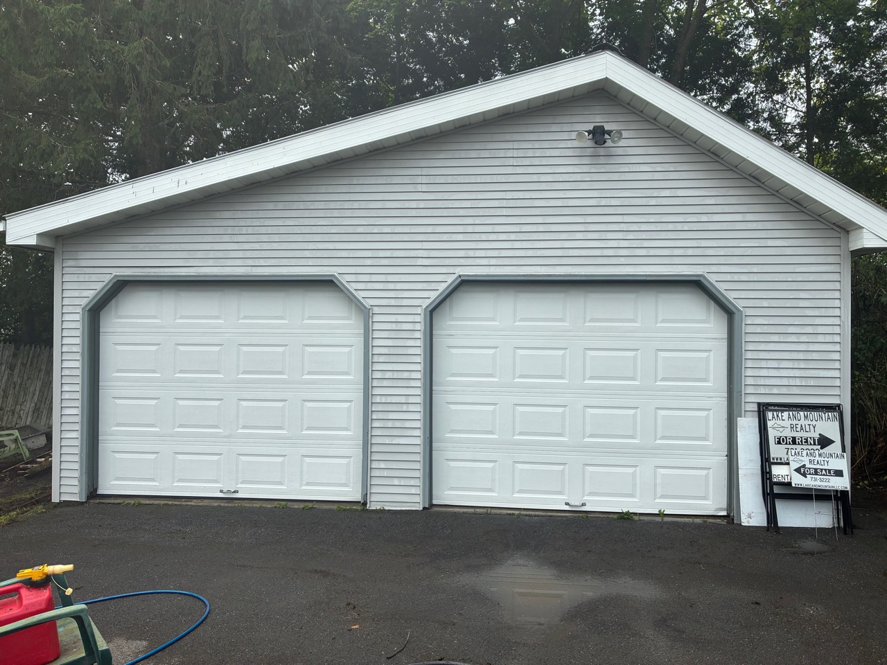 Garage siding and doors after professional exterior cleaning