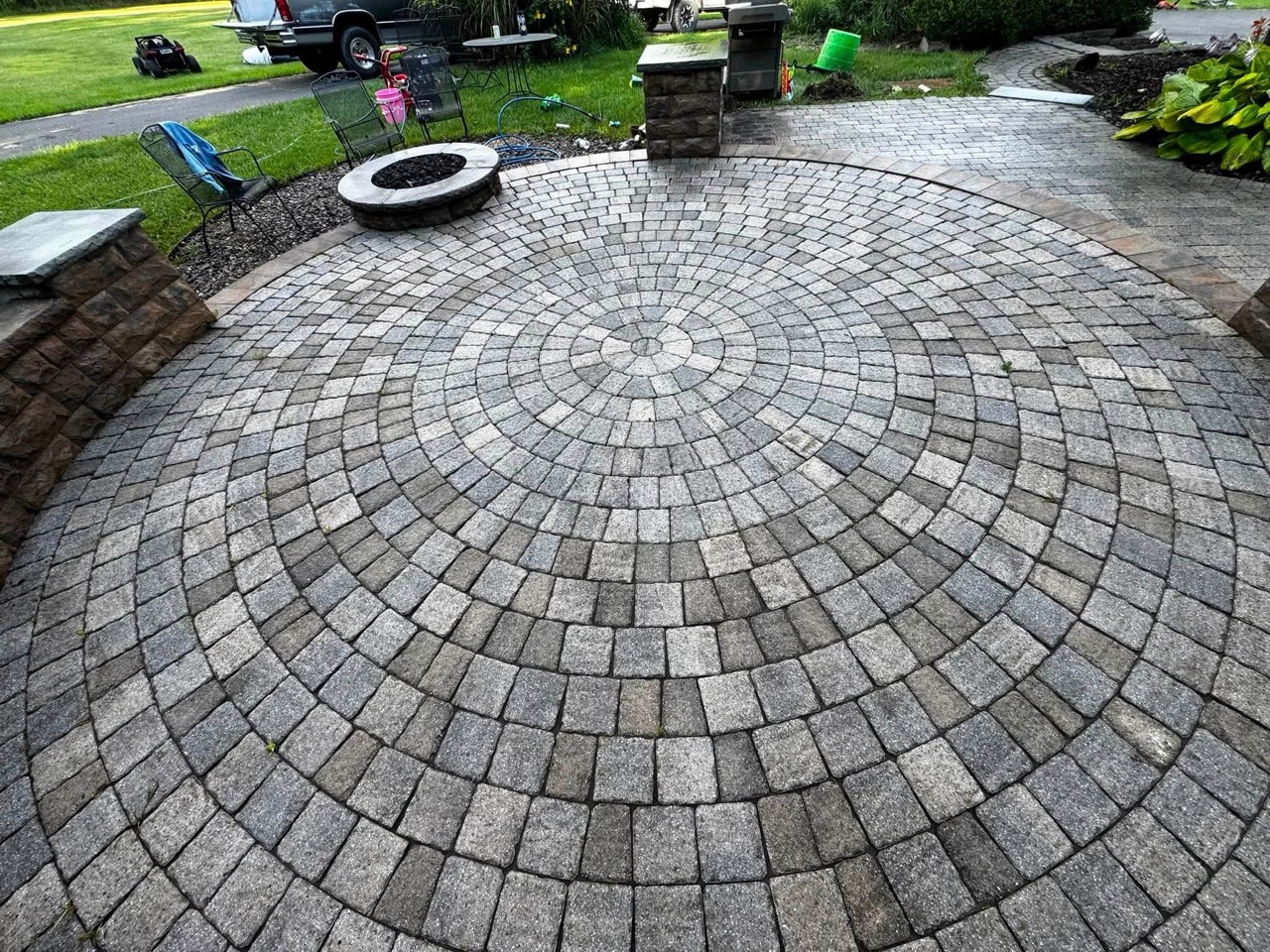 Circular paver patio viewed from above after professional cleaning